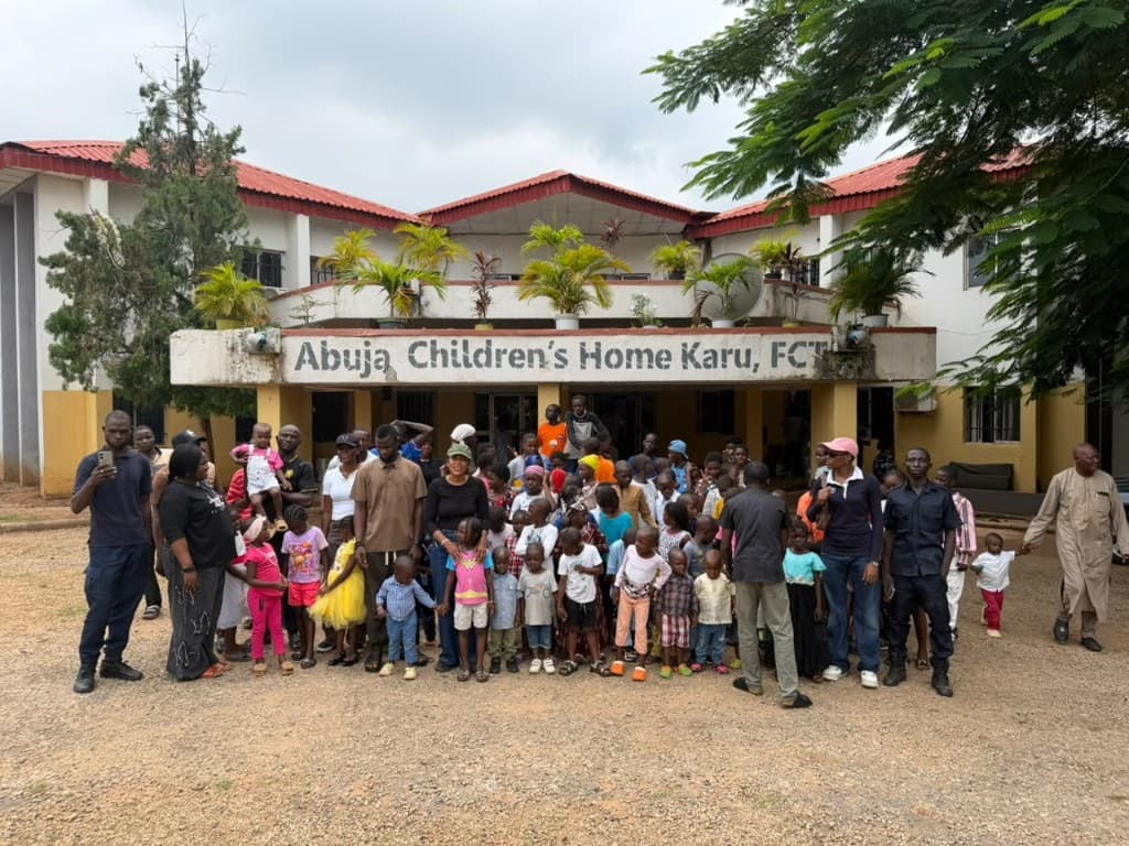 Paulo Group team and children gathered in front of Abuja Children's Home, Karu